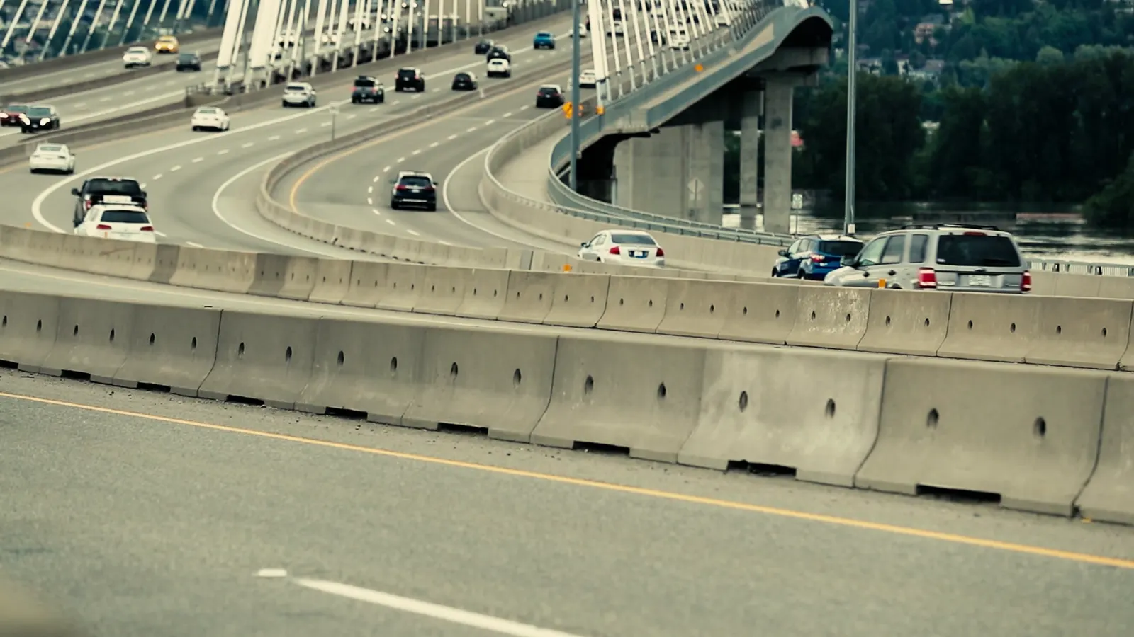 Cars crossing an urban highway bridge in daylight