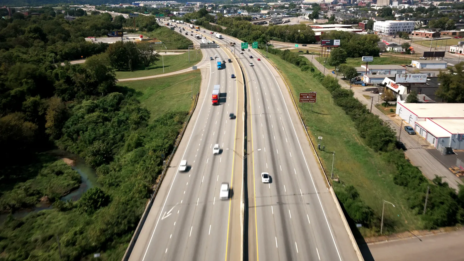 Aerial view of highway traffic moving through the region at dusk